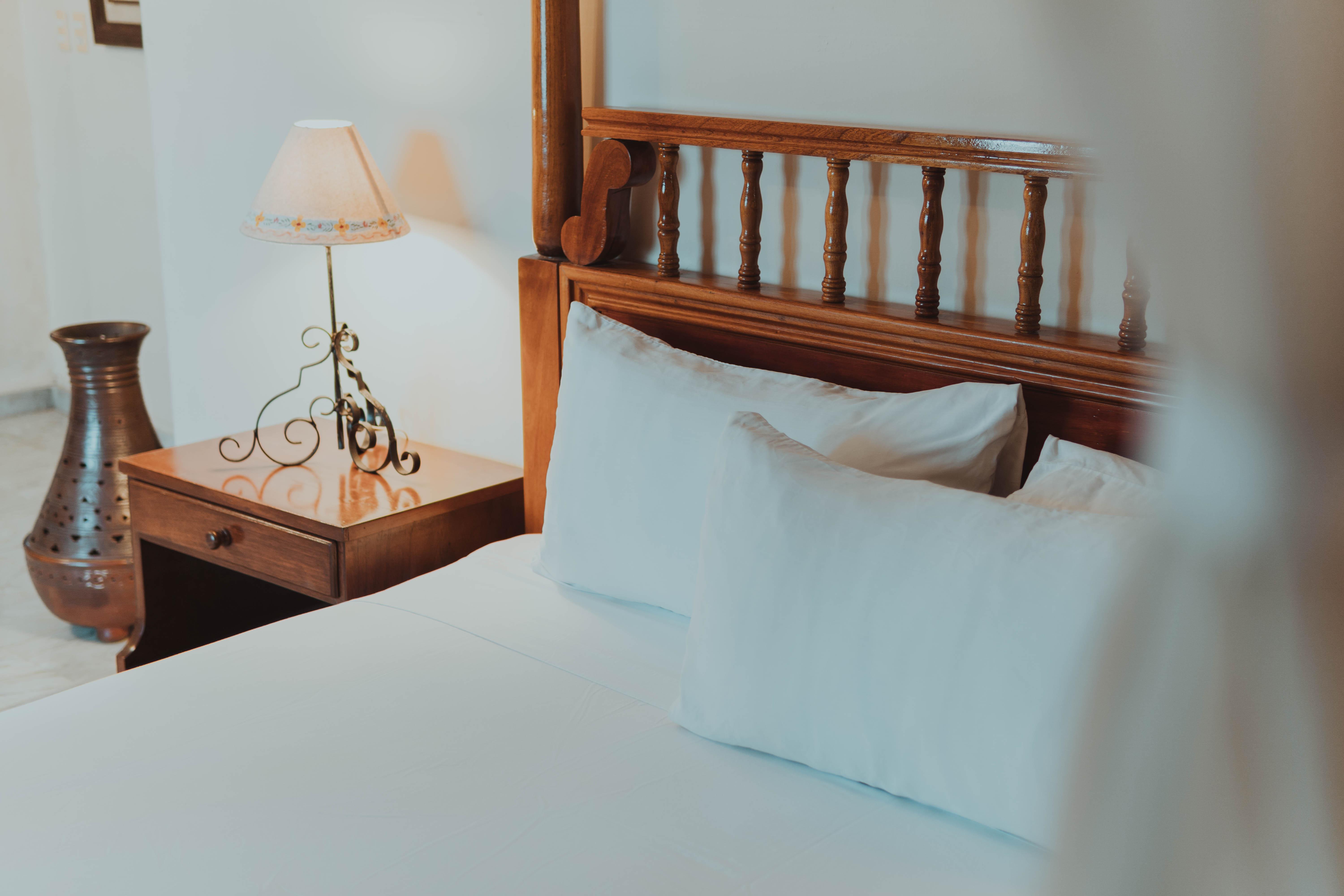 Hotel Casa del Balam Mérida Exterior foto A bed with a nightstand